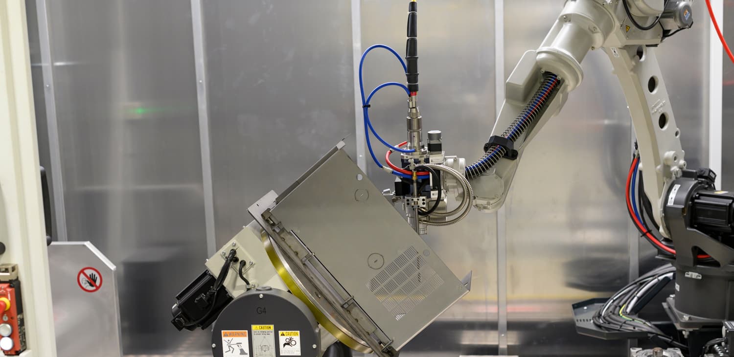 Welding robot welding a sheet metal part